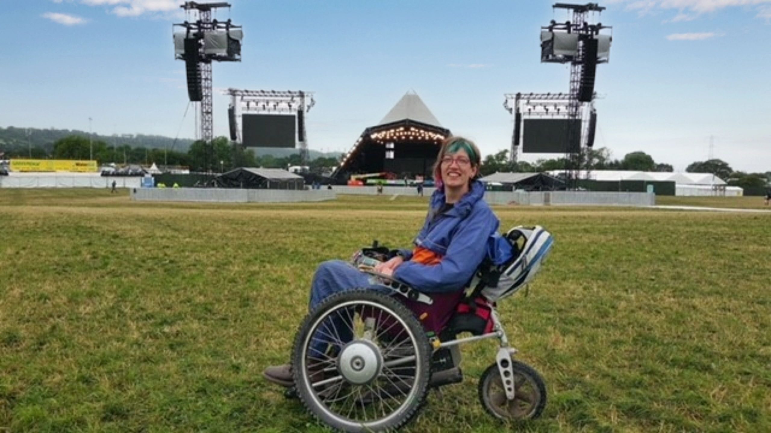 woman in Trekinetic GTE wheelchair at Glastonbury festival in England