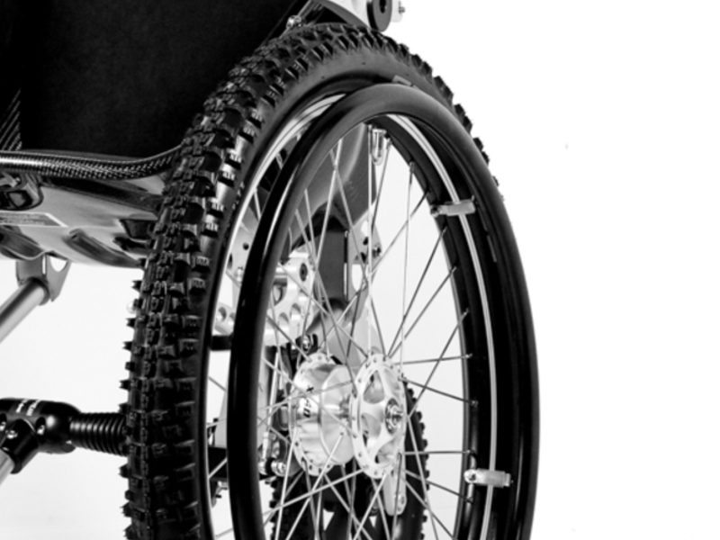 Close up of Trekinetic hand rims and mountain bike tyres on K2 off road wheelchair