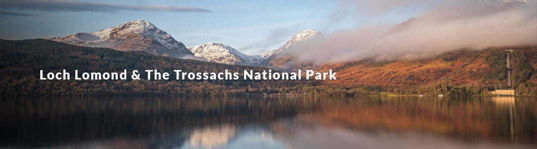 A picture of a vista with a lake in the foreground and a mountain scape in the background. With a heading Reading "Loch Lomond"